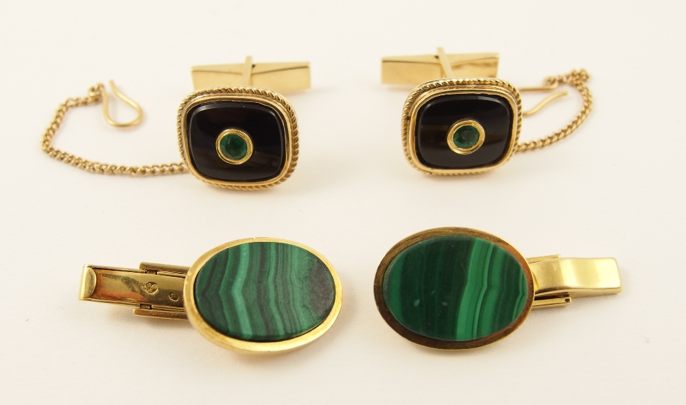 Two pairs of cufflinks a pair in 14ct yellow gold set with green gem stones (probably emerald) set