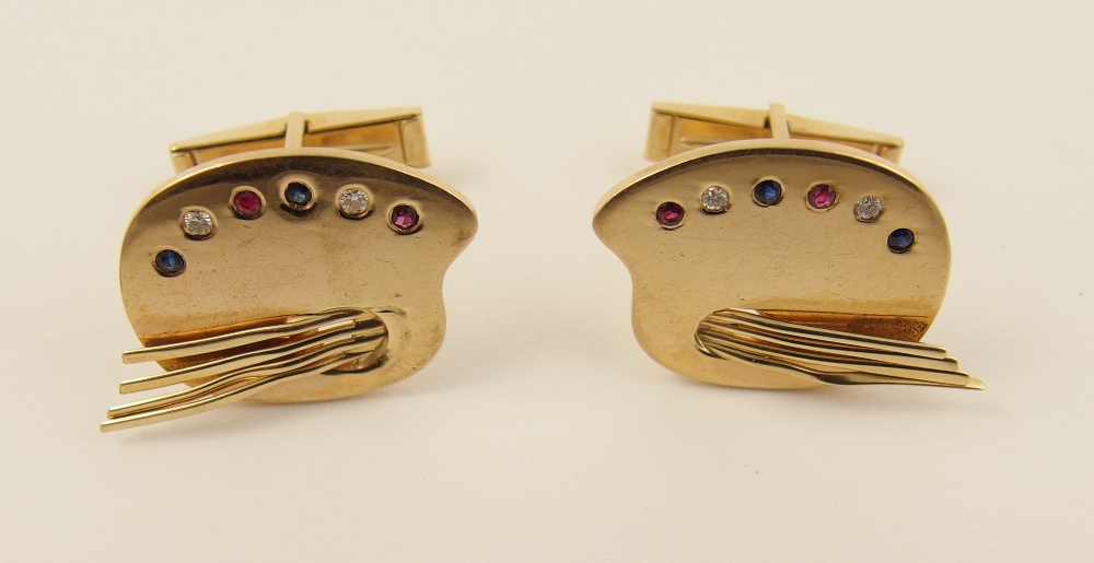 A pair of 14ct cufflinks modelled as a painters palette and set with brilliant cut diamonds rubies