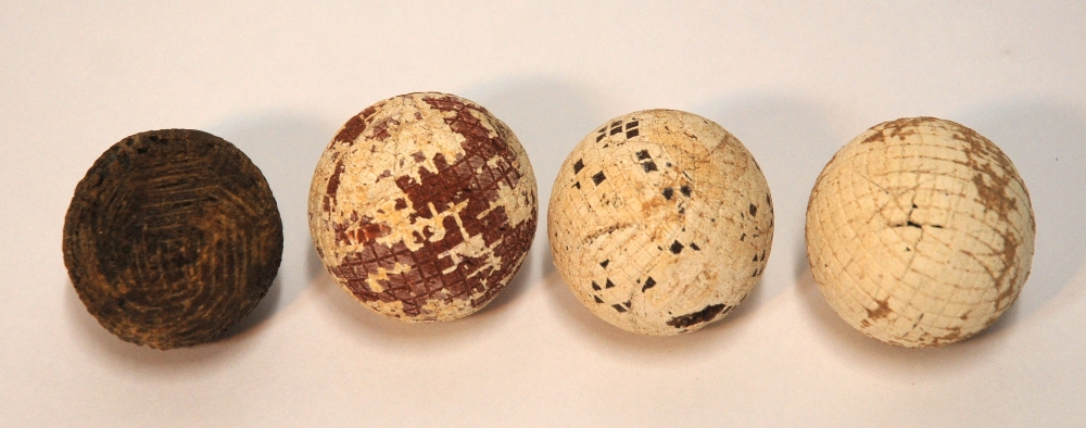 A hand-hammered gutty golf ball three machine-cut gutty balls, one stamped The Eureka and eight