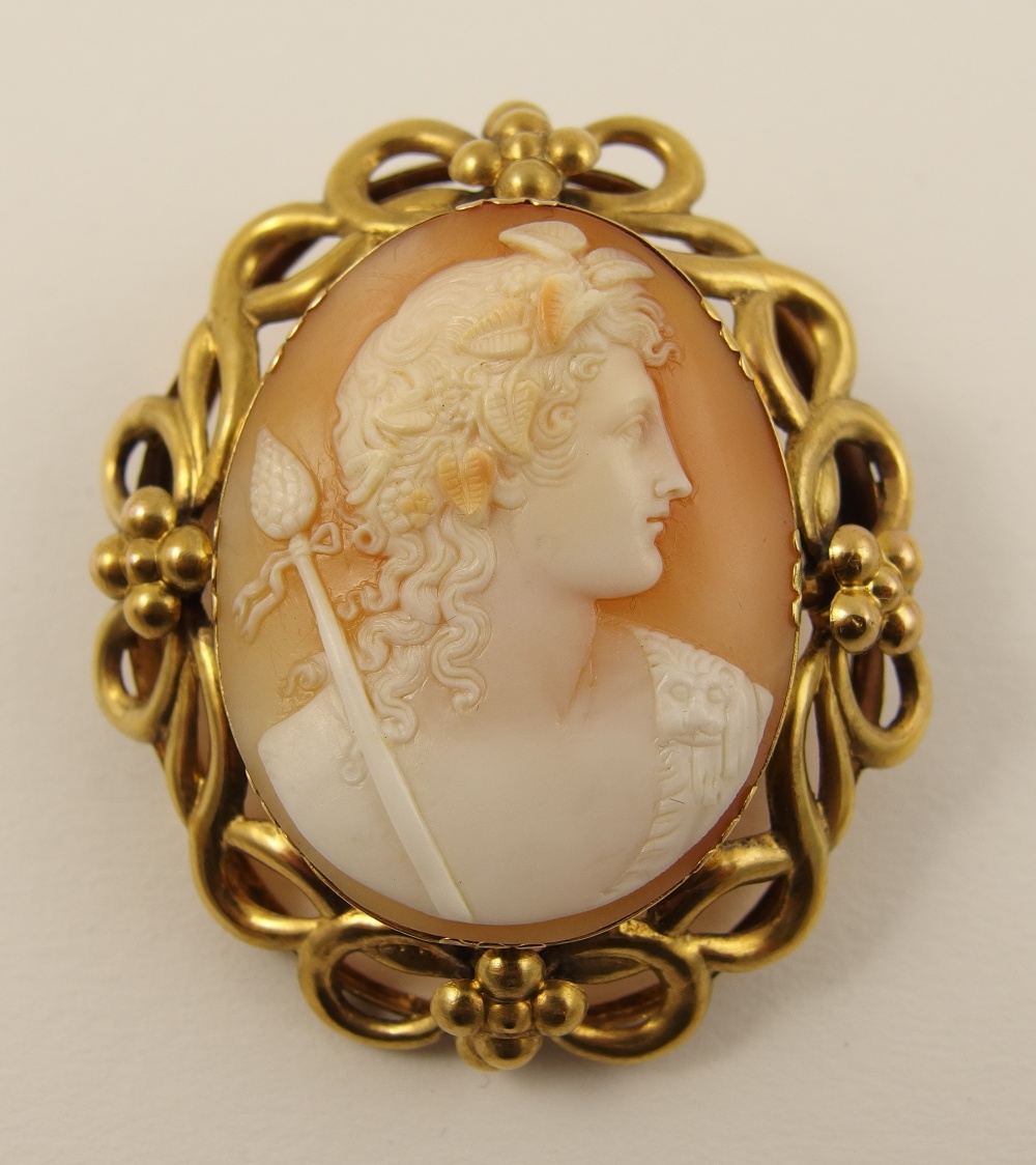 A shell cameo of a classical youth, probably Heracles. Dimensions of cameo 3.7cm x 3cm.