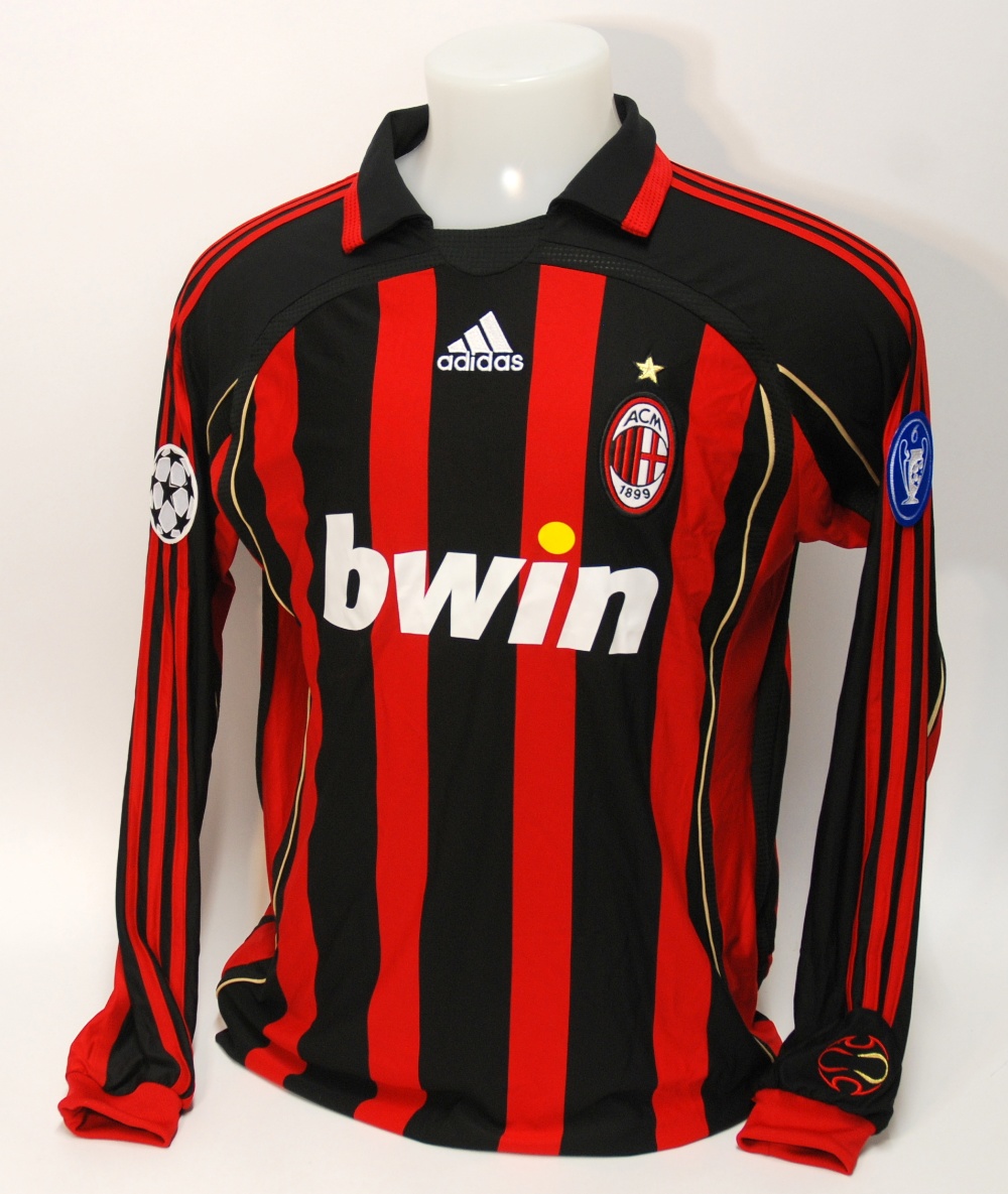 A red and black AC Milan shirt No.21, with v-neck collar and embroidered cloth badge, inscribed ACM,