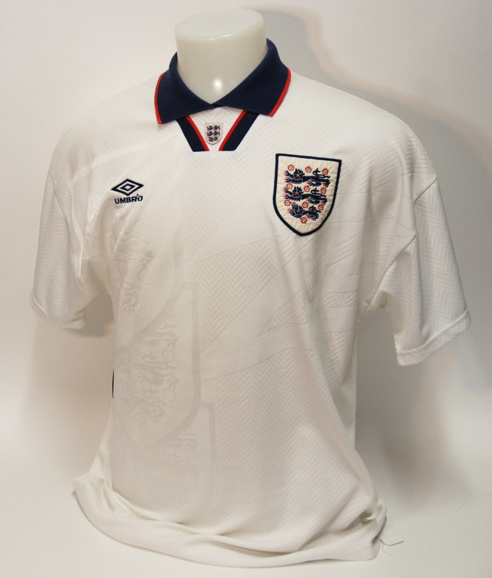 A white England International short-sleeved shirt No.9, with v-neck collar and embroidered cloth