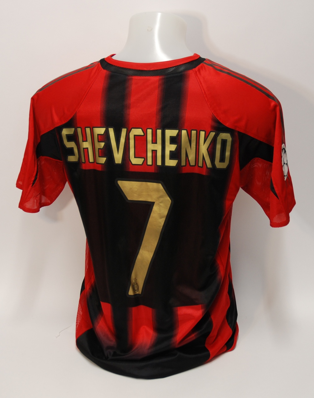 A red and black AC Milan short-sleeved shirt No.7, v-neck collar and embroidered cloth badge,