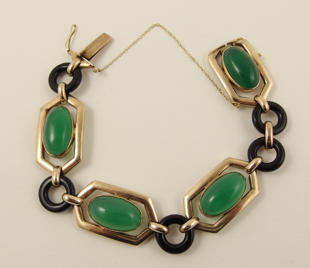 An Art Deco style bracelet made in 9ct gold and set with dyed green agates and black glass