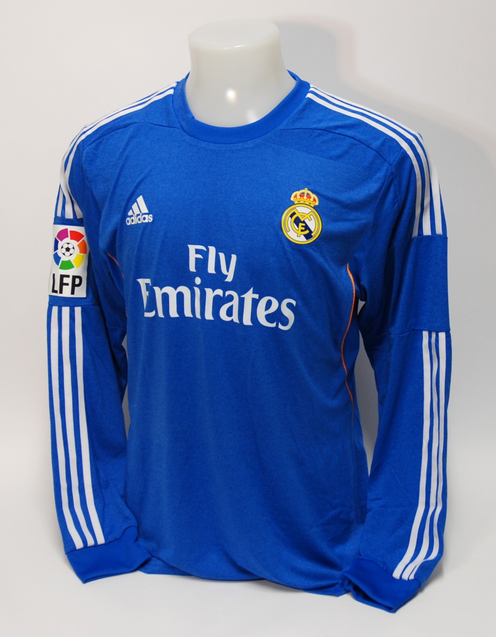 A blue Real Madrid shirt No.7, with crew-neck collar and printed badge, the reverse lettered