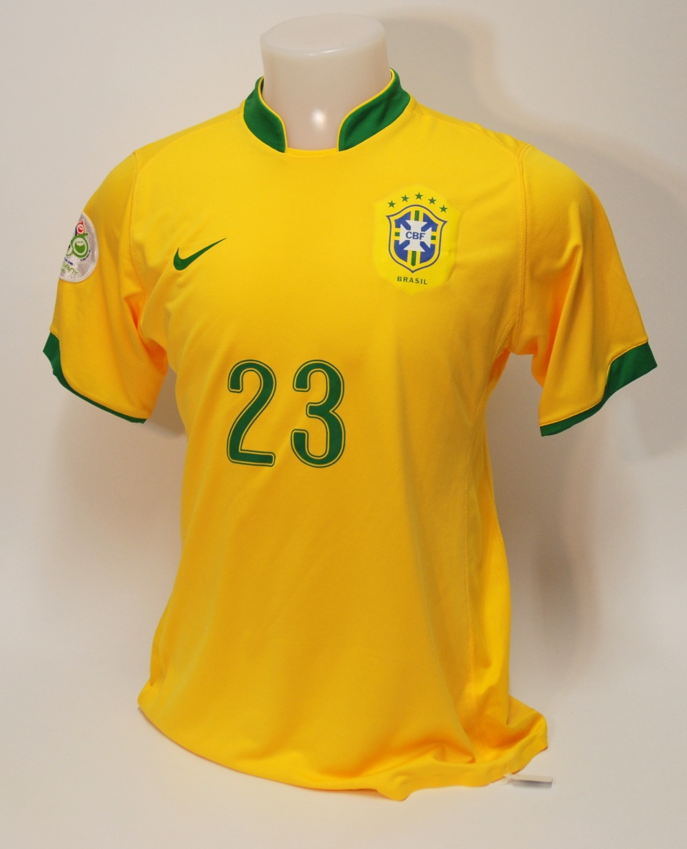 A yellow Brazil short-sleeved shirt No.23, with crew-neck collar and printed badge CBF, the