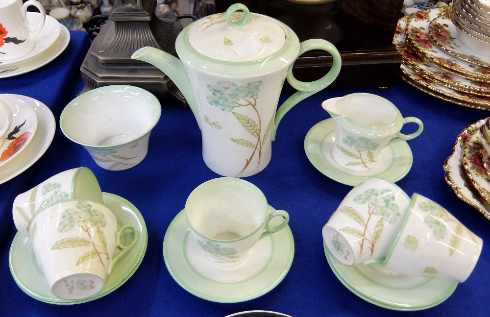 A Shelley porcelain Regent coffee set decorated with the `Sweet William` pattern no. 12489,
