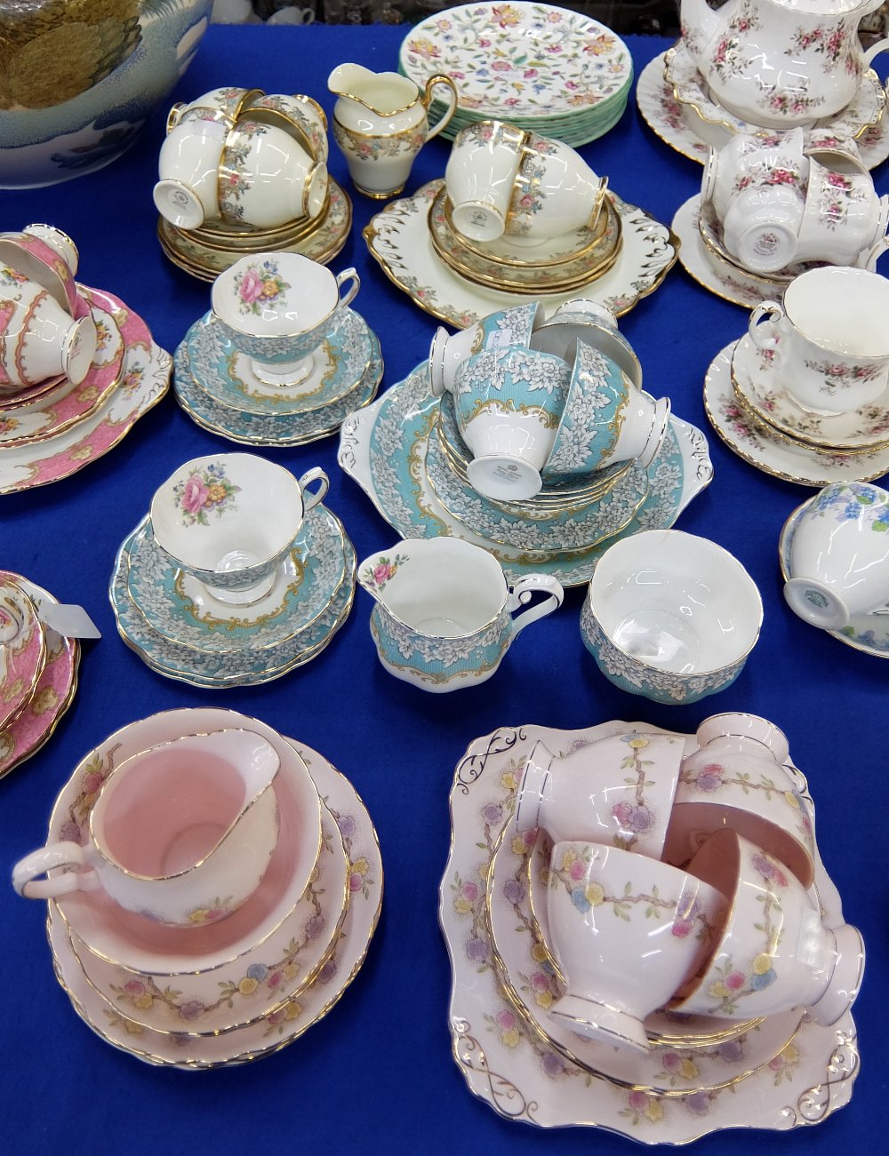 A Tuscan china part tea set, a Royal Albert porcelain `Enchantment` tea set comprising six tea cups,