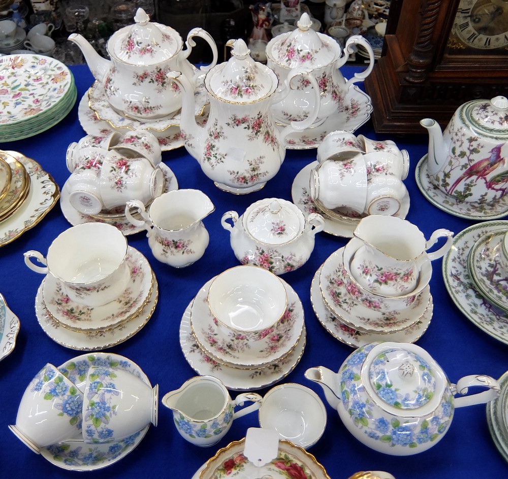 A Royal Albert Lavender Rose extensive tea service comprising two tea pots, a coffee pot, nine tea