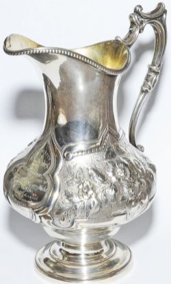 Ornate sterling silver Jug manufactured by Elkington England, exquisitely engraved "Presented To