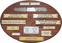 Wooden board containing a good quantity of Signal Box instrument and shelf plates in traffolite
