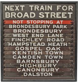 Wooden Destination Board with 13 chocolate & cream enamel indicators. The top is painted `Next Train
