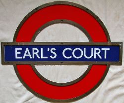 LT Station Target in shaped bronze frame EARL`S COURT. Three separate enamel sections, the name