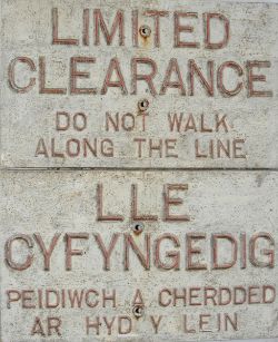 A pair of interesting, alloy Notices, one in English and one in Welsh. English text reads `Limited