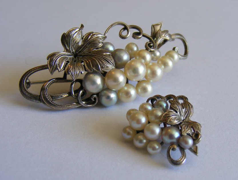 "A fine pair of white metal Brooches each set with Pearls, and formed as a bunch of grapes with a