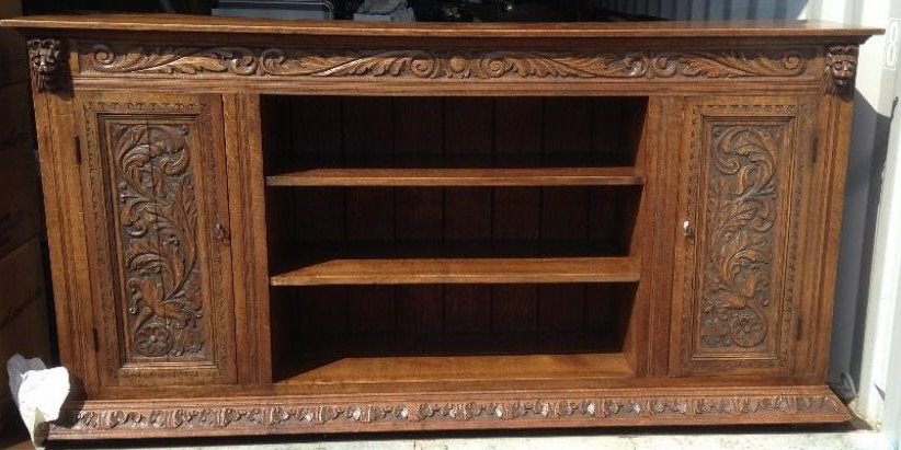 "An oak Sideboard/Bookcase with carved detail including lions heads, matching partner to the