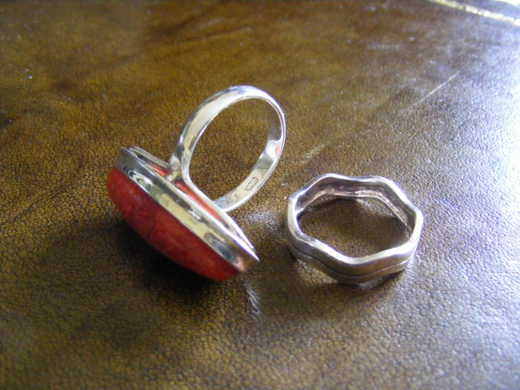 "Two white metal Rings each 925 stamped, one set with a lozenge-shaped stone, the other a simply