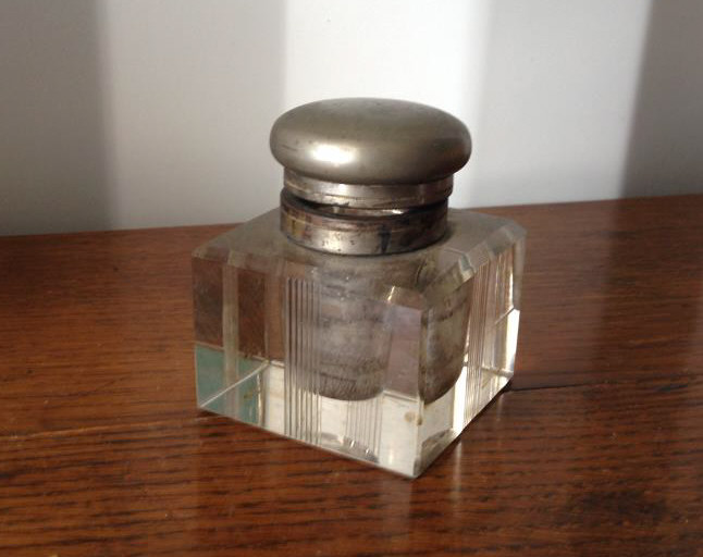 "A Deco-period glass Inkwell with plated lid, approx height 4"."