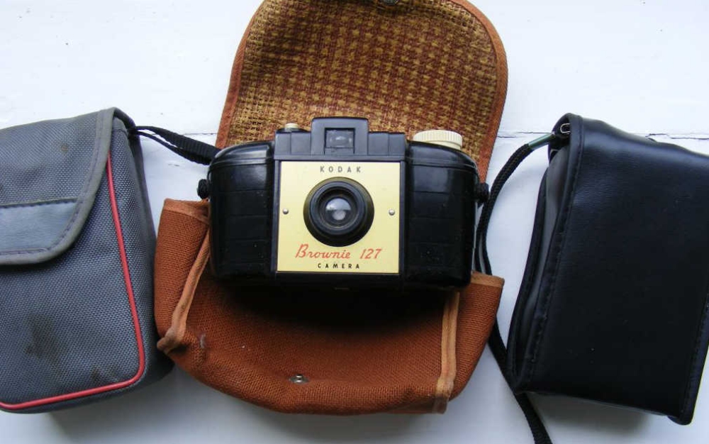 A Kodak Brownie Camera and two others.