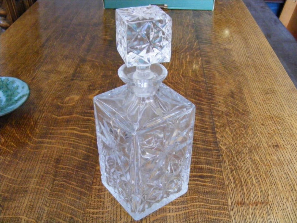 A pair of square cut Whisky Decanters each with stopper.