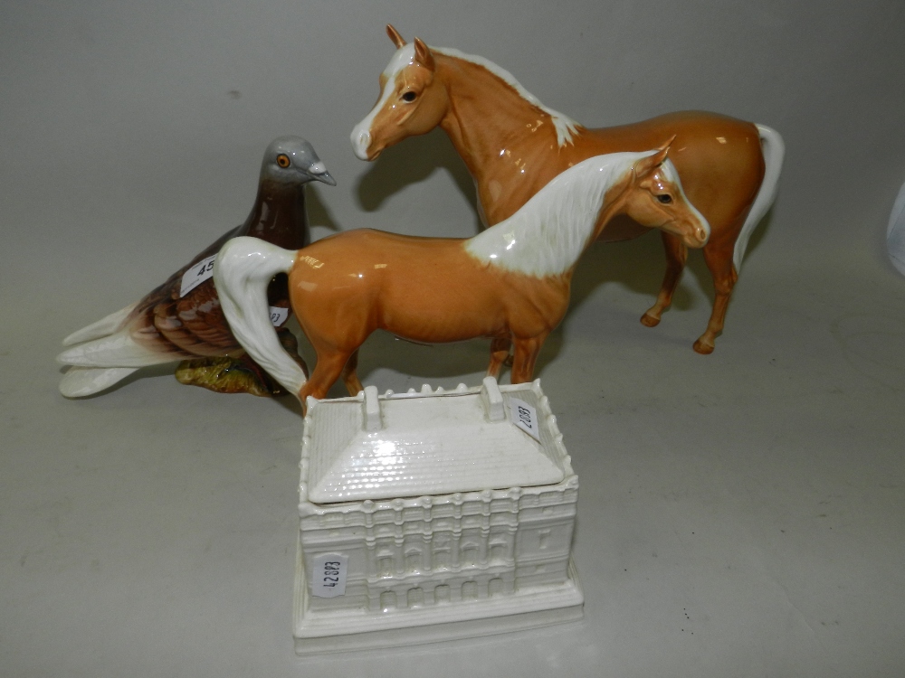 A Beswick model of a pigeon, together with two Beswick models of horses and a Cauldon Ivorine