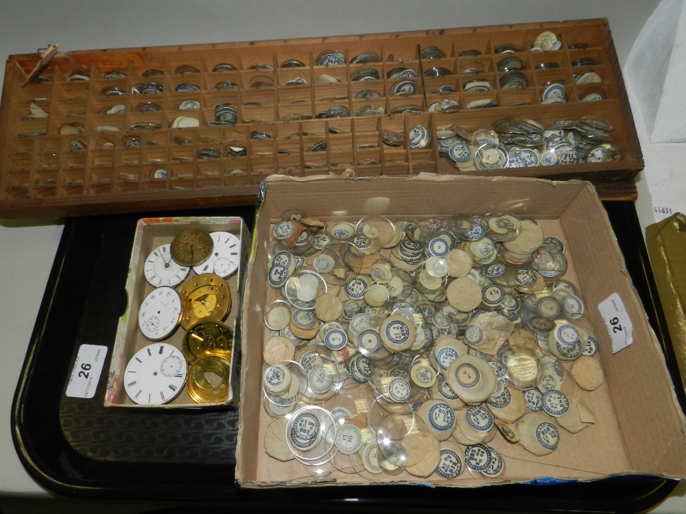 A large collection of watch glasses, together with various watch movements.