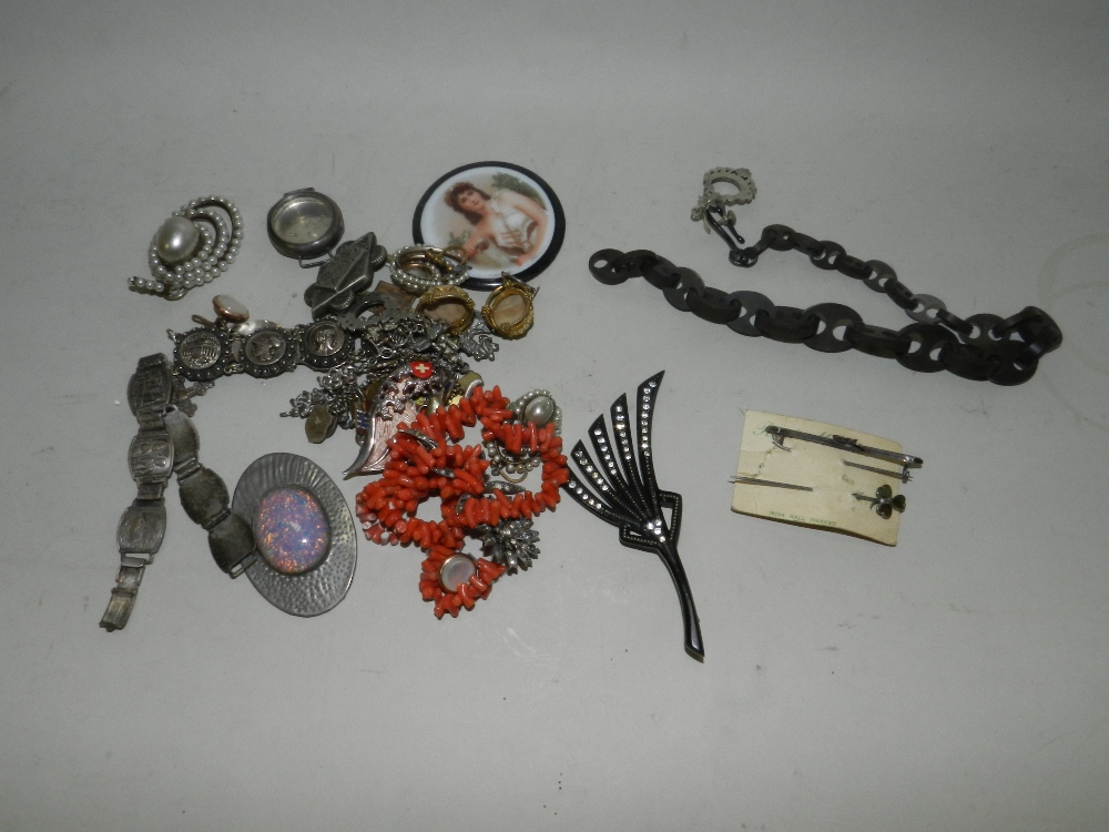 A stick coral necklace together with a white metal plaque bracelet and various other pieces of