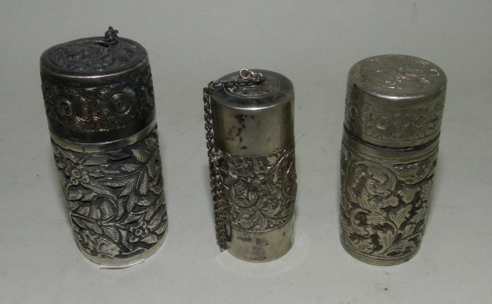 Three continental white metal spice shakers, one lacking the pierced grill.*