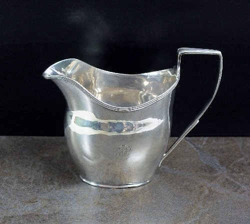 A George III silver cream jug, Robert Urquhart, London 1803, of plain polished oval form with