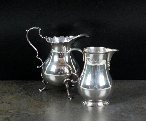 A silver sparrow beak cream jug, Goldsmiths and Silversmiths Co Ltd, London 1913, of baluster form