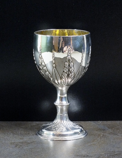 A George III silver goblet, makers mark rubbed, London 1773, the goblet with embossed tapered