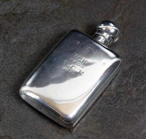 A Victorian silver hip flask, Goldsmiths & Silversmiths Co, London 1899, of plain polished