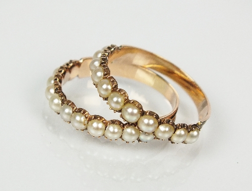 Two 19th century split pearl set rings, each designed as a row of eleven split pearls claw set to