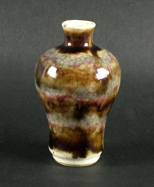 A Chinese small baluster vase, late 19th century, with an all-over Jun style glaze of blues, purples