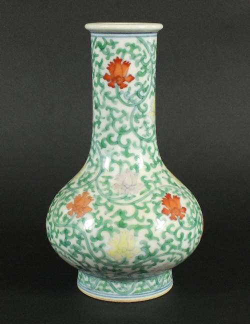 A Chinese porcelain Ming-style doucai vase, 20th century, of bottle form with bulbous body and