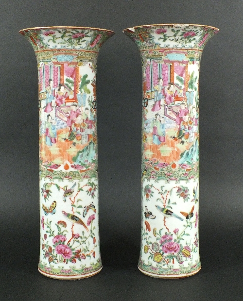 A pair of Chinese porcelain Canton enamel famille rose sleeve vases, 19th century, each of elongated