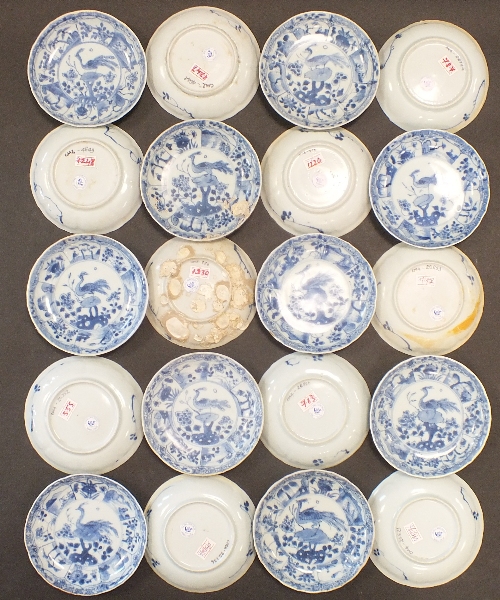 Ca Mau: Twenty blue and white Peacock Pattern saucers, circa 1725, each centrally decorated with a