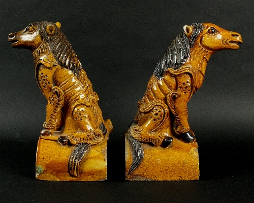 Two Chinese glazed terracotta roof tile figures, 19th century, each modelled as a Longma with