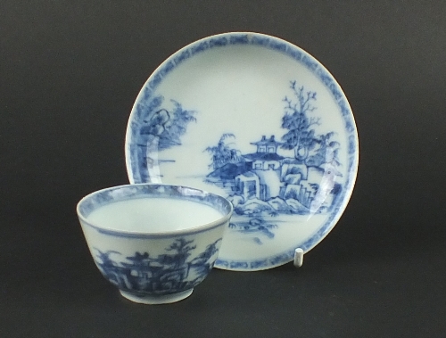 A Chinese blue and white tea bowl and saucer from the Nanking cargo, rescued from the wreck of '