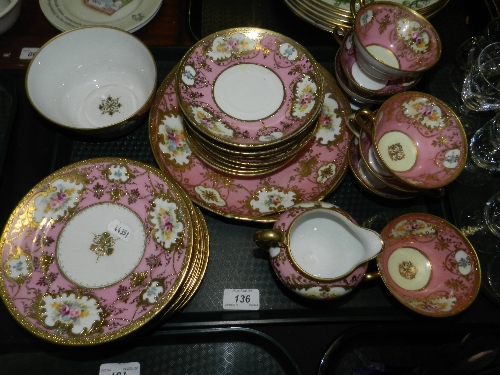 An L & Co Nippon porcelain pink ground part tea service, decorated with painted panels of flowers,