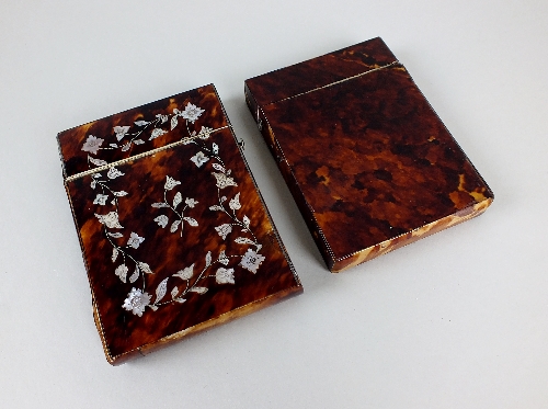 A Victorian tortoiseshell and mother-of-pearl card case decorated with scrolling leaves and flowers,