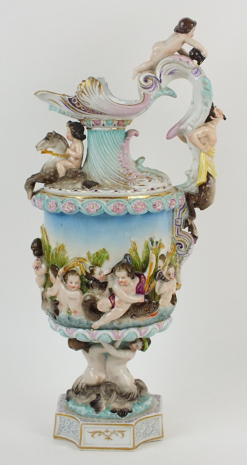 An Italian Capodimonte-style porcelain ewer, late 19th century, relief decoration all around in
