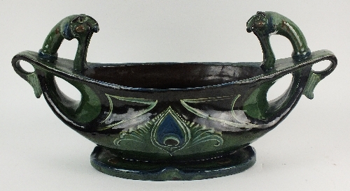 An unusual C H Brannam of Barum centrepiece bowl, dated 1904, green glazed body decorated with Art