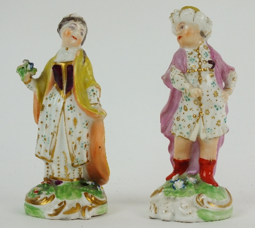 A pair of Derby porcelain figures in Turkish Costume, circa 1765, male and female, the male with