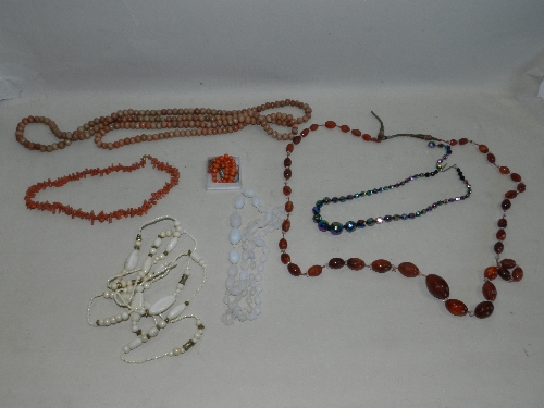 A coral necklace (at fault) together with an agate bead necklace, another coral necklace etc