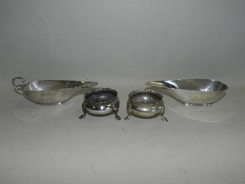 A pair of George V silver bun salts, together with two silver sauceboats, Birmingham, 1920