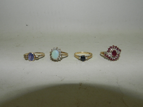 A diamond and opal flowerhead ring together with a 15ct gold amethyst set ring, a diamond and ruby