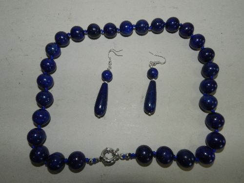 A Lapis Lazuli bead necklace together with a pair of earrings