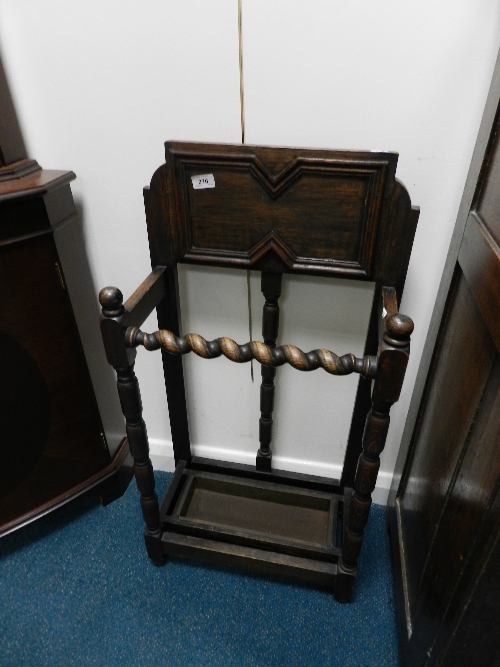 A 1920s oak stick stand