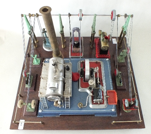 A Wilesco Steam Engine mounted on a display board together with a comprehensive range of belt driven